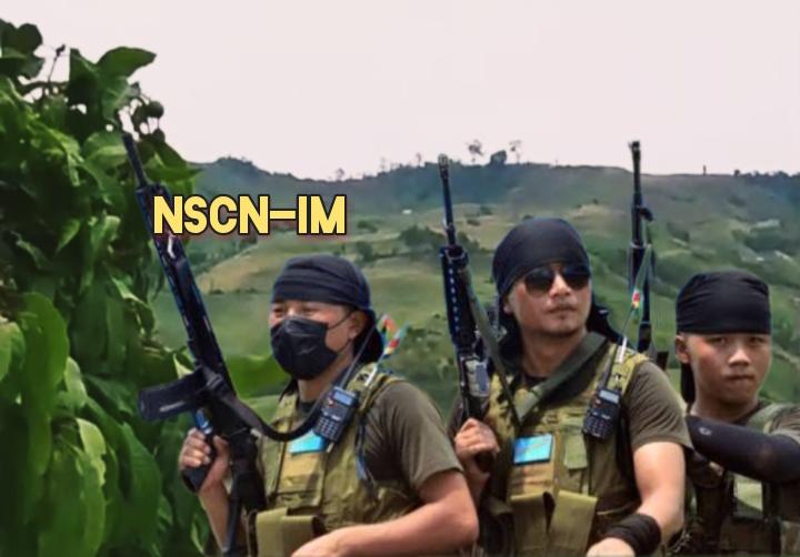 Armed men standing outdoors in a mountainous region with NSCN-IM text visible in the image.