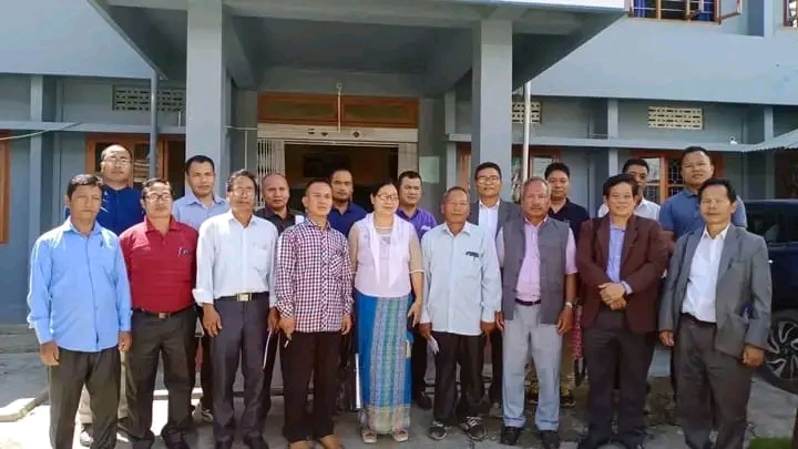 Group photo of Kuki Christian leaders standing outside a building during a peace and reconciliation meeting.