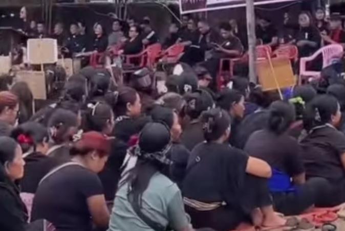 Women seated during a peaceful protest organized in Moreh over violence in Manipur.