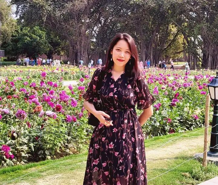 Portrait of Dr Hatchingthem Haokip in a flower garden