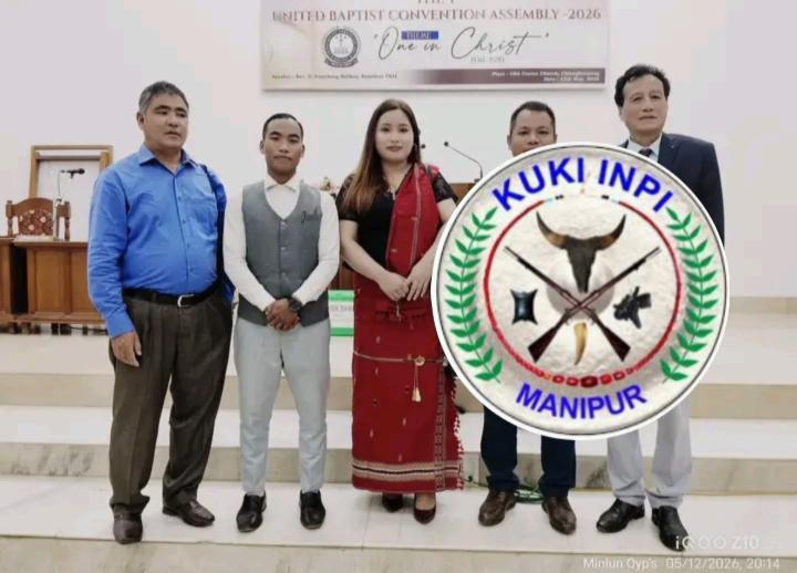 Church leaders and community representatives posing inside a church hall